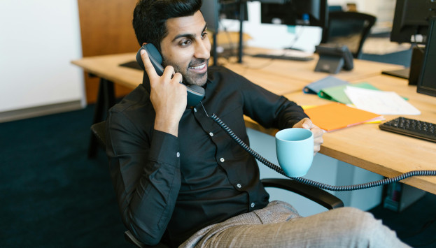 stock photo south asian man on phone