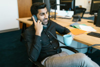 stock photo south asian man on phone